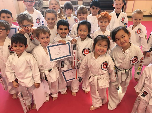 Infants enjoying a karate class in Cardiff
