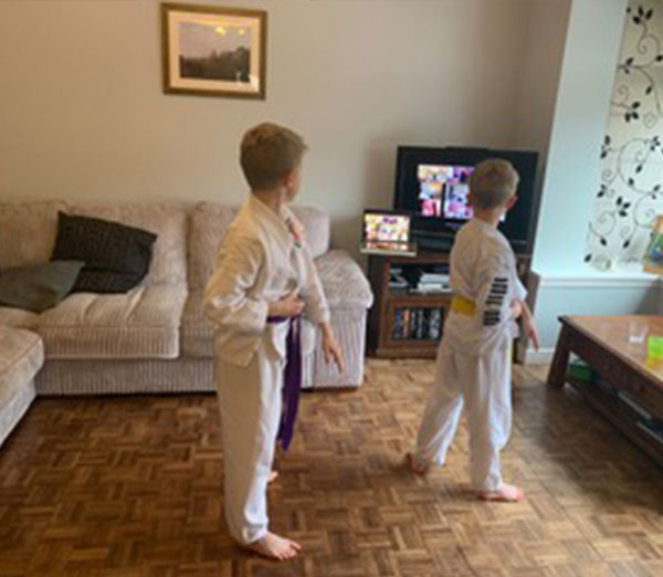 Children age 3 to 6 enjoying a live streamed karate lesson