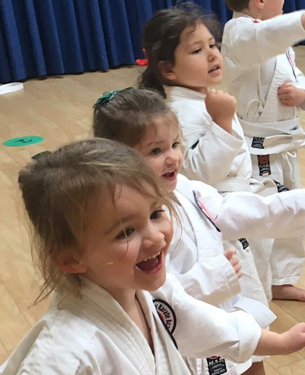 Children age 3 to 4 enjoying a karate lesson